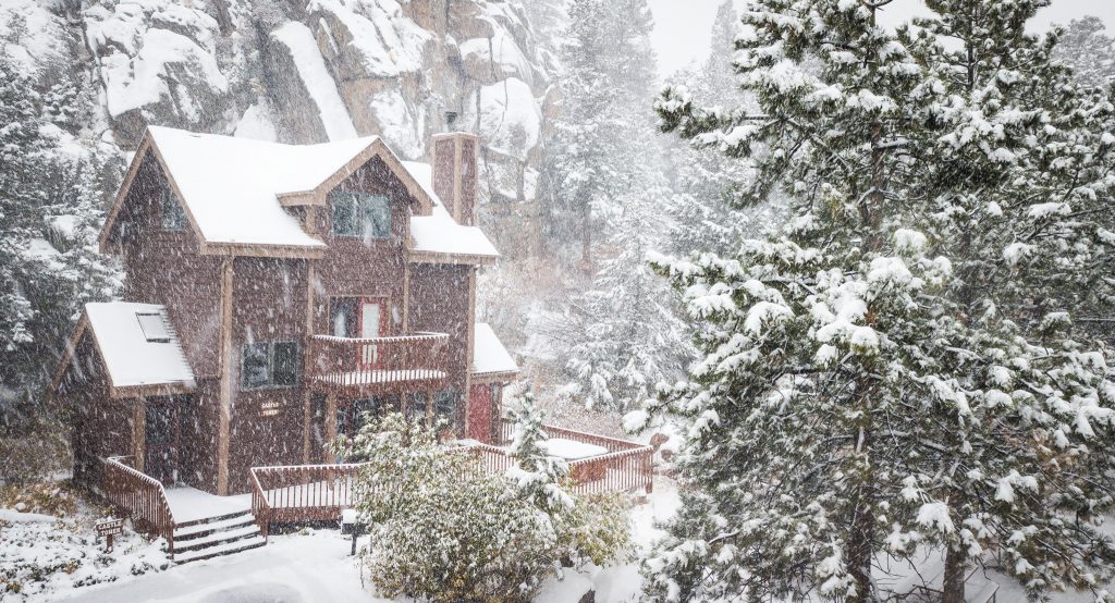 Fireplace cabin with snowy mountain view Estes Park